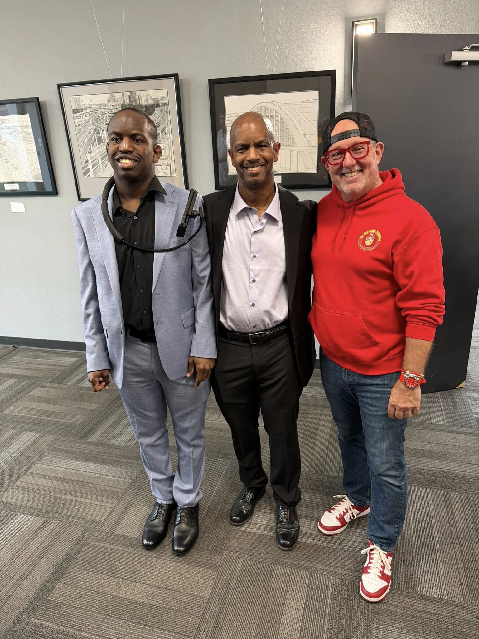 Adam Cline at his art gallery with Dash Gordon Foundation founder Tim Glover