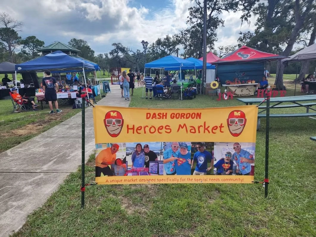 The Dash Gordon Heroes Market banner and vendor tents at a past event
